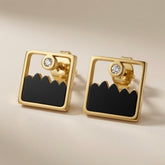 Mountain Horizon Stud Earrings - angled flat lay of pair showing gold frame depth and enamel detail