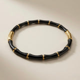 Noir Bamboo Enamel Bangle - elevated flat lay showing full silhouette