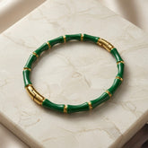 Vert Bamboo Enamel Bangle - top-down flat lay on white marble