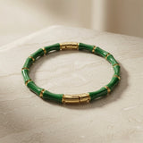 Vert Bamboo Enamel Bangle - angled view on travertine marble