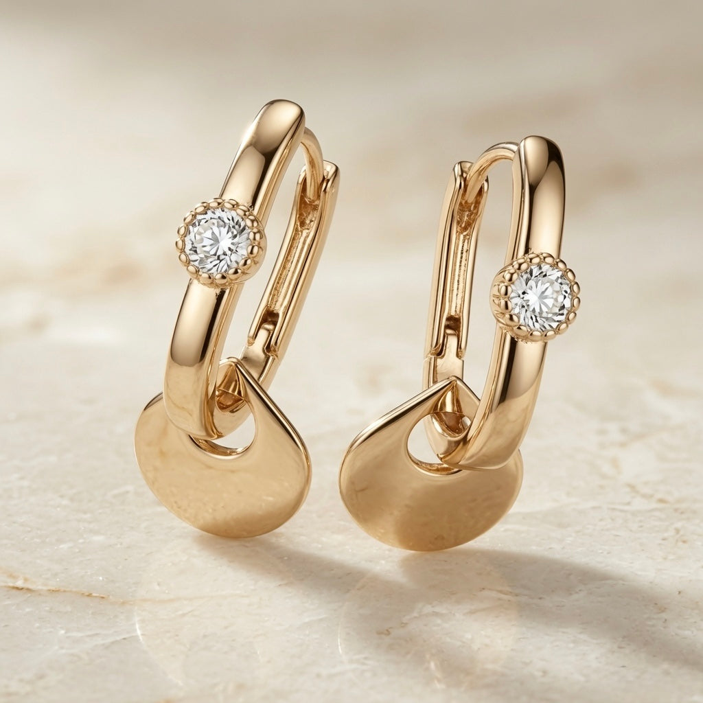 Disque Crystal Huggie Drop Earrings - pair on travertine showing rectangular huggie hoop, milgrain crystal and interlocked disc charm