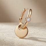 Disque Crystal Huggie Drop Earrings - single earring side profile on travertine showing click-lock huggie and disc drop length
