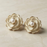 Camélia Blanc Pearl Stud Earrings - pair on marble showing ivory enamel three-tier camellia rose and freshwater pearl centre