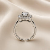 Princess Cut Double Halo Split Shank Adjustable Ring - side profile on ivory satin showing open adjustable band and elevated head: open-C band back construction clearly visible, split shank double-rail pavé band with micro-pavé round white crystals on both rails, elevated square gallery platform below double halo head, princess cut centre stone above