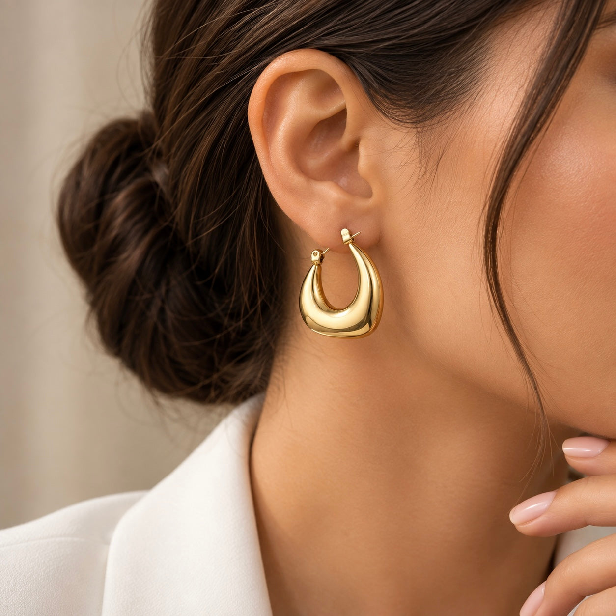 Chunky Crescent Moon Hoop Earrings Gold Mirror Polish - pair flat lay on dark brown satin: wide domed convex crescent hoop bodies in warm 18K gold mirror polish, deep concave inner crescent cuts creating moon negative space, click-hoop lever clasps at lower right of each hoop, tapered lower crescent tips