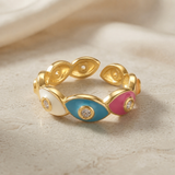 Chromatic Evil Eye Eternity Ring - front elevated view on marble showing full band and open back