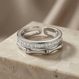Argent Bamboo Baguette Stack Ring - angled view on marble showing baguette crystal band and bamboo connectors