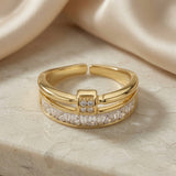 Or Baguette Clasp Stack Ring - angled side view on marble showing open back and double band profile