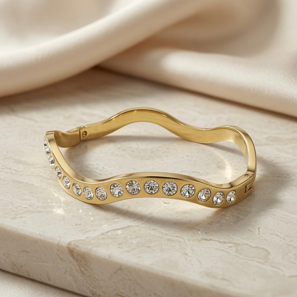 Wave Crystal Bangle - front view on marble with silk backdrop
