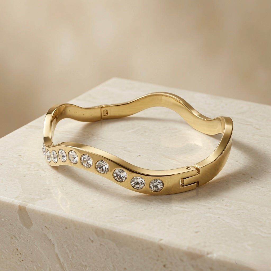 Wave Crystal Bangle - elevated angle showing wave silhouette on marble