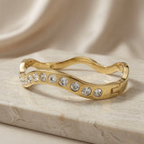 Wave Crystal Bangle - side view showing crystal graduation on marble
