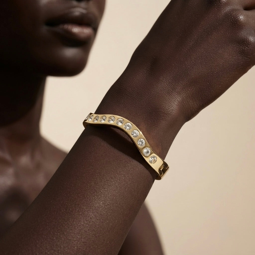 Wave Crystal Bangle - worn on dark skin model wrist close-up