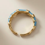 Azure Bamboo Enamel Ring - top-down view showing open back and textured gold interior