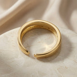 Rose Duo Stack Ring - back view on marble showing open adjustable back and hammered gold interior