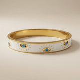 Evil Eye Enamel Bangle - front angled view showing evil eye motifs on white enamel