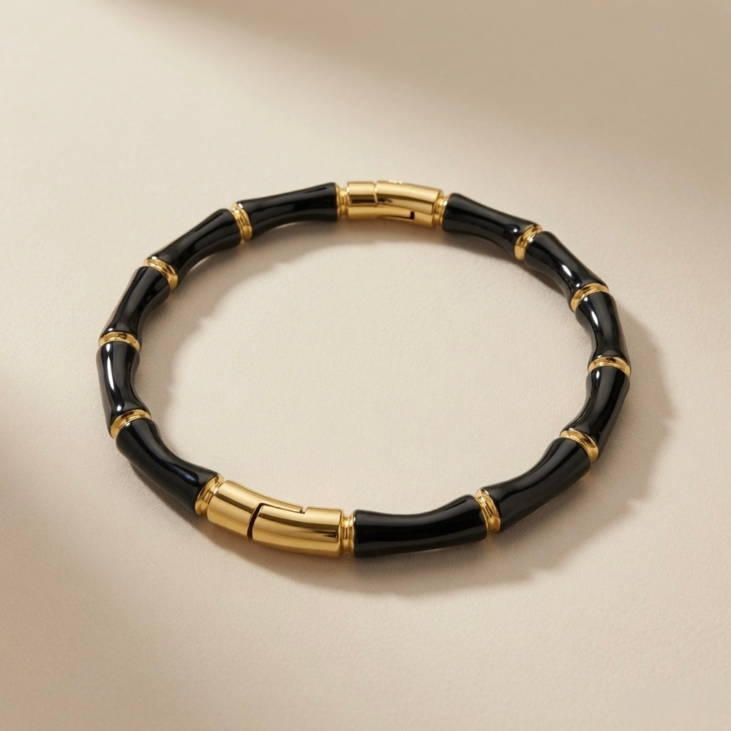 Noir Bamboo Enamel Bangle - front flat lay showing gold connectors