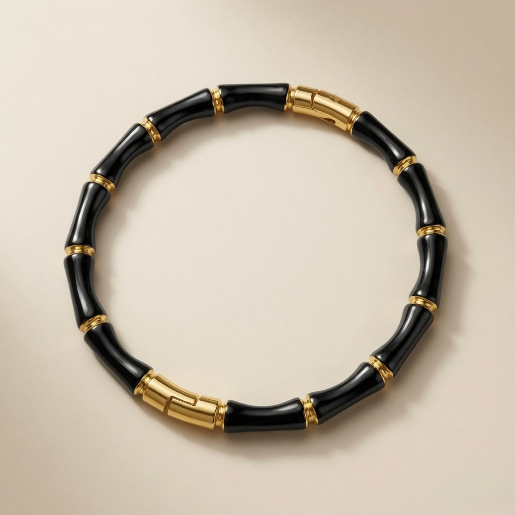Noir Bamboo Enamel Bangle - top-down flat lay on neutral background