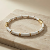 Blanc Bamboo Enamel Bangle - angled view on marble block