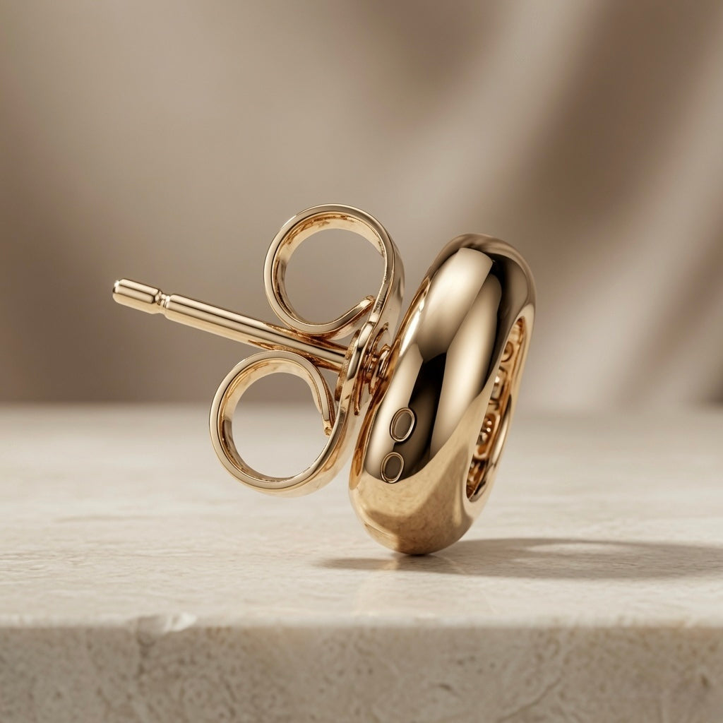 Molten Pear Crystal Stud Earrings - back view showing double-loop butterfly push-back fastening on marble