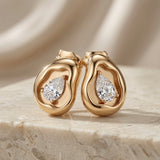 Molten Pear Crystal Stud Earrings - pair front view showing full sculptural form and pear crystal on marble
