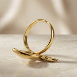 Fleur Gold Bloom Ring - side view on marble showing open adjustable band and petal depth