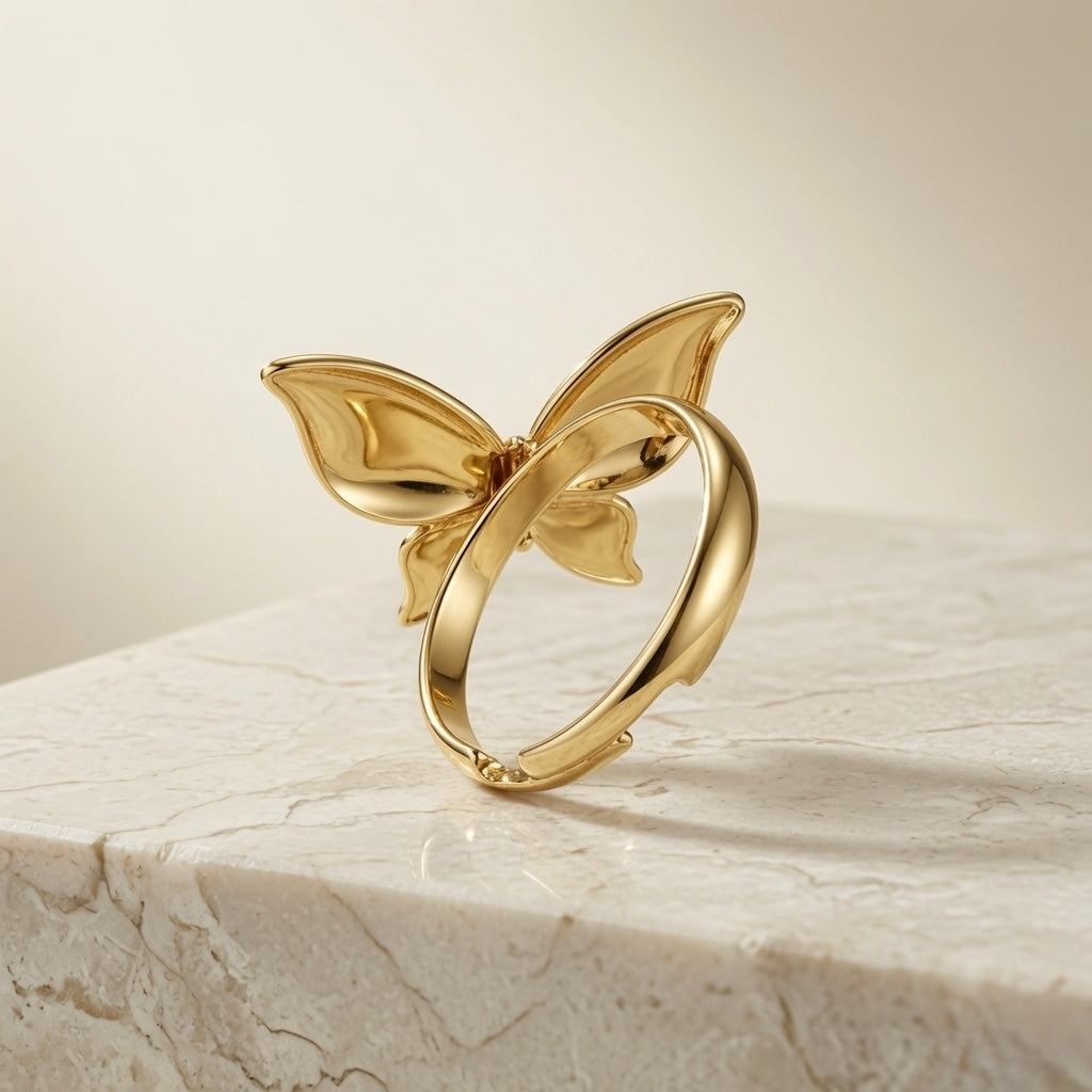 Fleur Gold Bloom Ring - side profile on marble showing butterfly wing petal silhouette