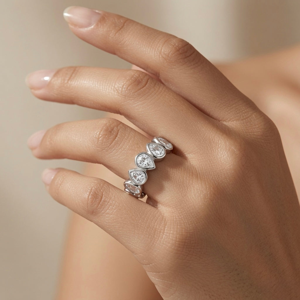 Larme Pear Crystal Eternity Ring - worn on model hand showing slim profile and continuous pear crystal sparkle