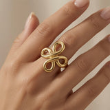 Infinity Bloom Gold Ring - worn on model hand showing scale and commanding presence of the infinity bloom centrepiece