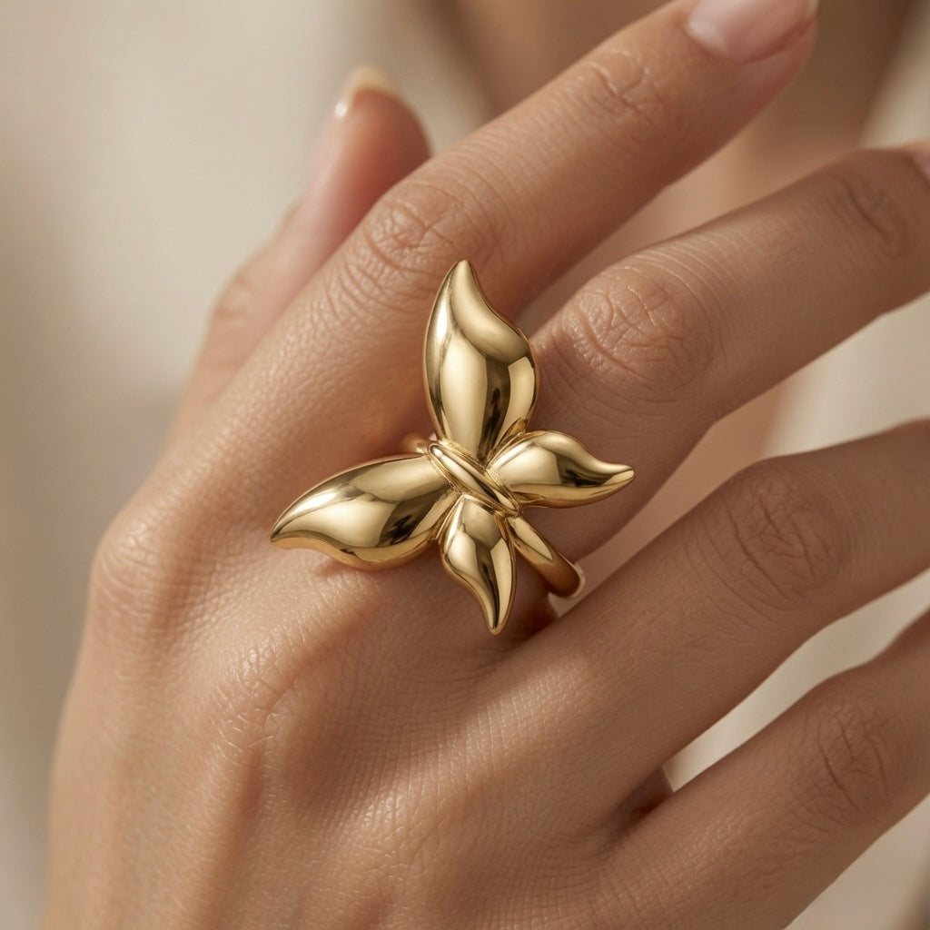 Fleur Gold Bloom Ring - worn on model hand showing knuckle-spanning bloom and warm gold glow