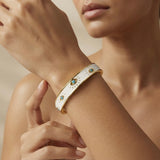 Evil Eye Enamel Bangle - worn on model wrist editorial close-up