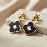 Noir Fleur Crystal Drop Earrings - pair on marble block with silk backdrop showing full drop length and gold border detail
