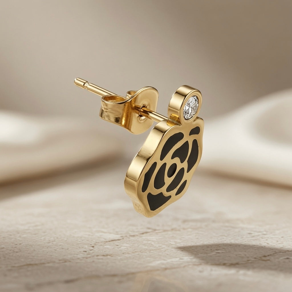 Camélia Noir Crystal Earrings - single drop style earring floating showing butterfly back, crystal bezel and camellia drop detail