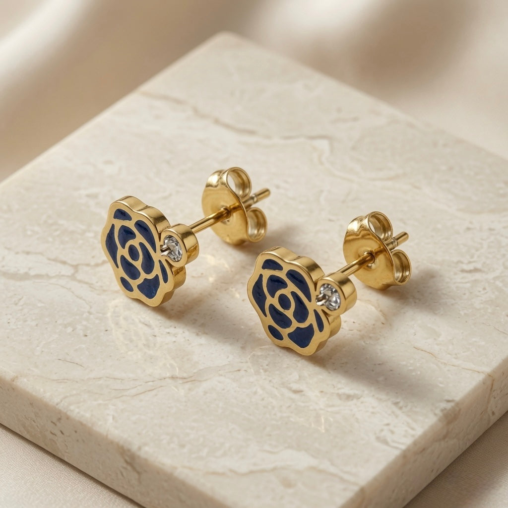 Camélia Noir Crystal Earrings - navy enamel stud style pair on marble showing midnight navy camellia rose and crystal accent