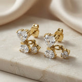 Noeud Crystal Bow Drop Earrings - pair flat lay on marble showing full bow and drop composition from above