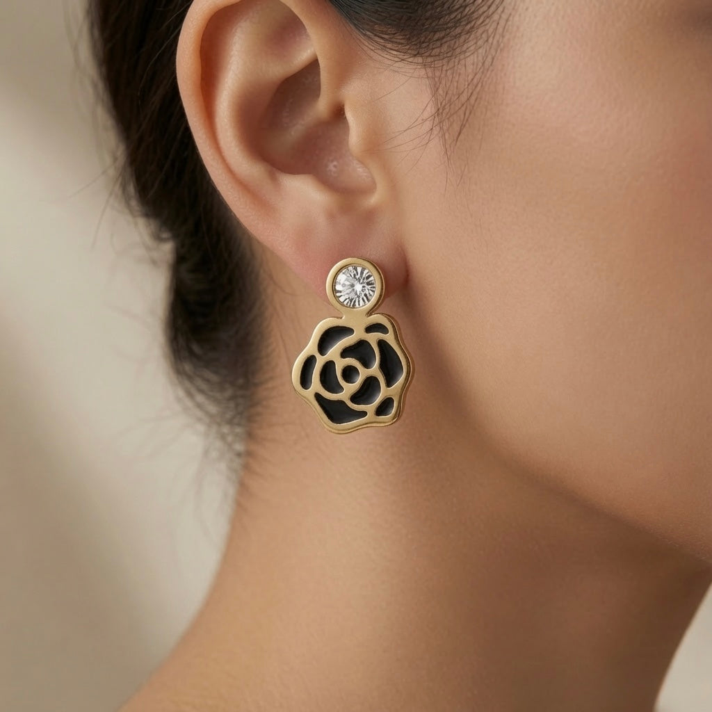 Camélia Noir Crystal Earrings - drop style worn on model ear showing crystal stud top and black camellia flower drop against skin