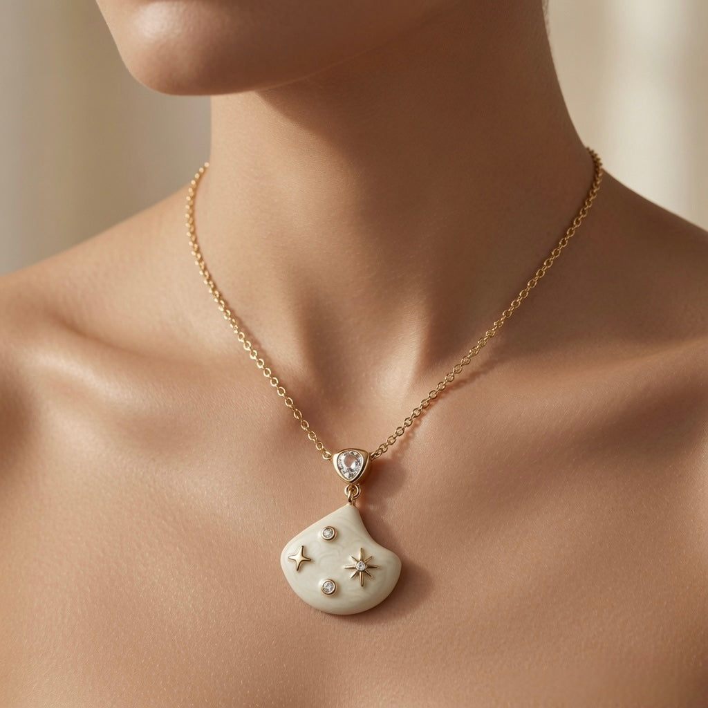 Constellation Ivoire Jewellery Set - necklace worn on mannequin décolletage showing pear crystal connector and ivory fan pendant at collarbone length