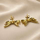 Ruban Puffy Bow Stud Earrings - pair back view on champagne silk showing reverse of both large puffy bow stud earrings: standard gold posts centred on back of bow with butterfly clutch backs, warm 18K gold mirror-polish surface on reverse of lobes and tail strands