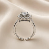 Princess Cut Double Halo Split Shank Adjustable Ring - side profile on ivory satin showing open adjustable band and elevated head: open-C band back construction clearly visible, split shank double-rail pavé band with micro-pavé round white crystals on both rails, elevated square gallery platform below double halo head, princess cut centre stone above