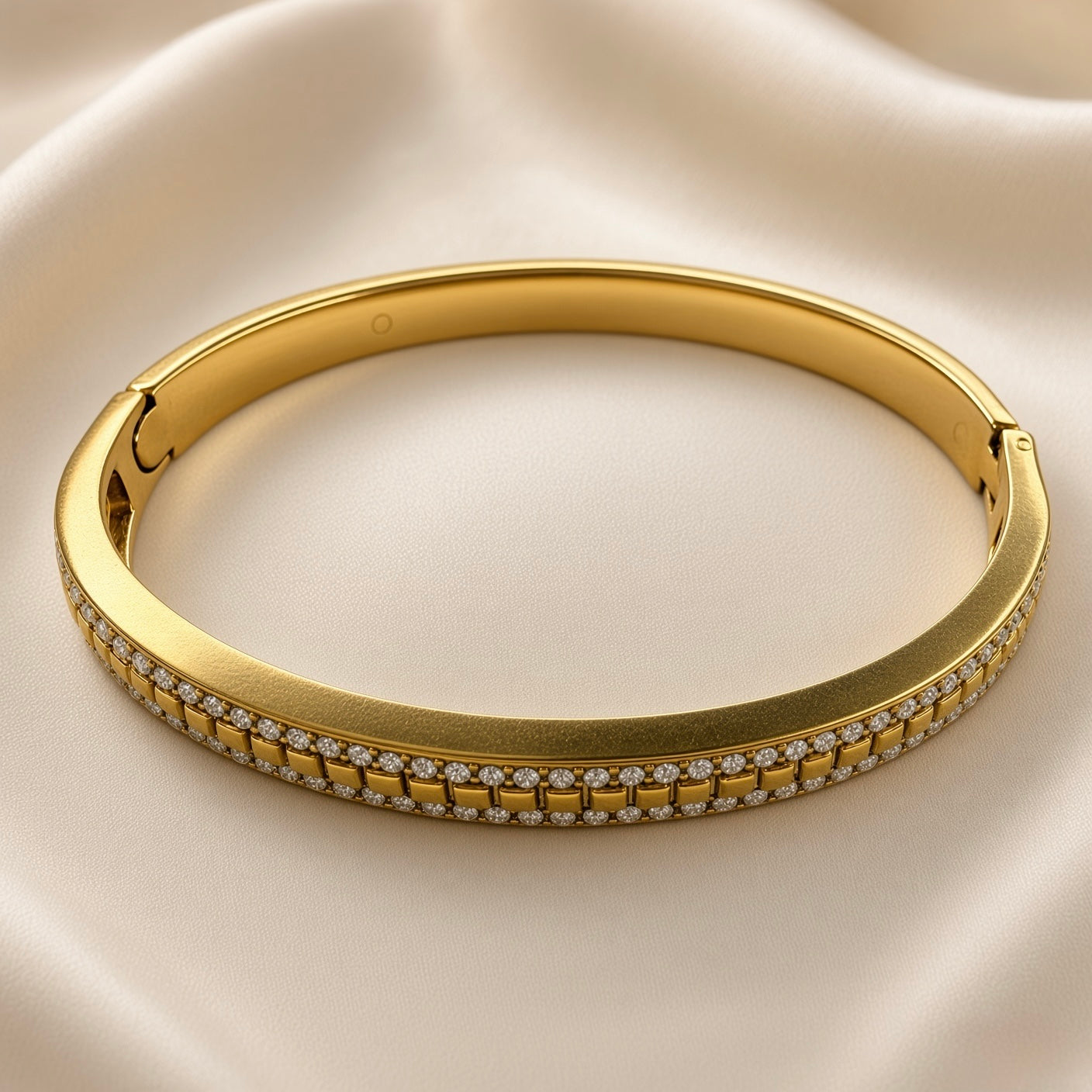 Gold-plated stainless steel bangle with clear stones and geometric square-link detail