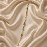 Woman wearing the multicolour crystal gold-plated bracelet on her wrist