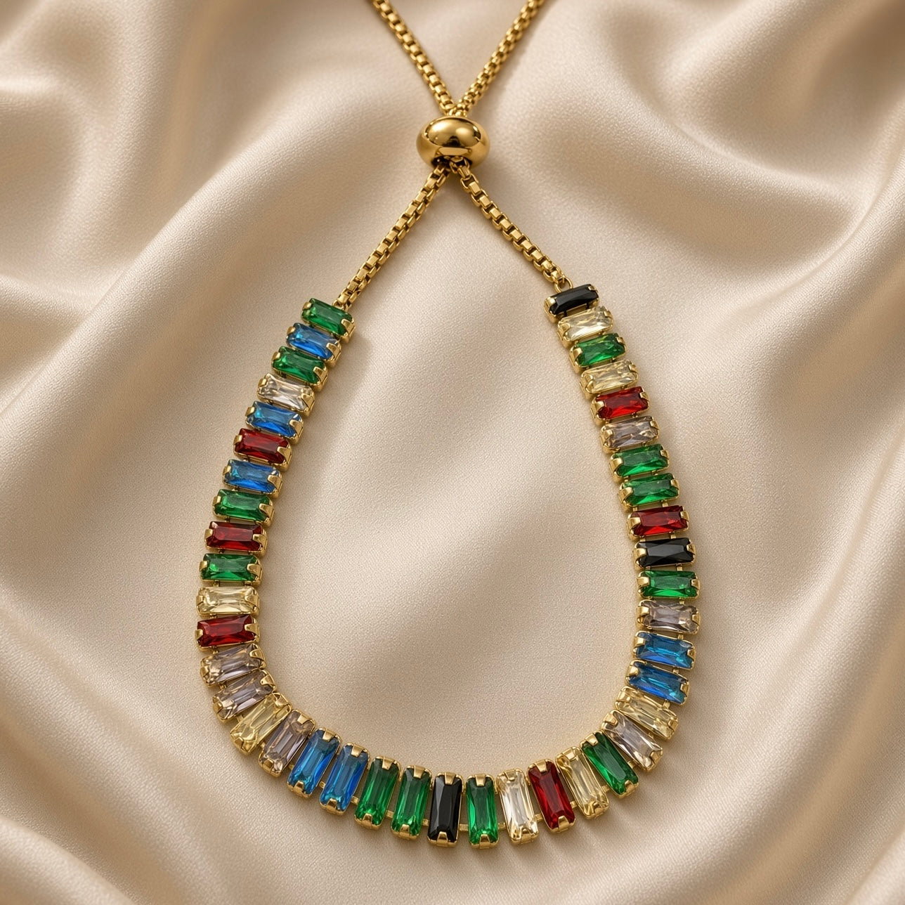 Front view of multicolour baguette stone bracelet with gold-tone slider