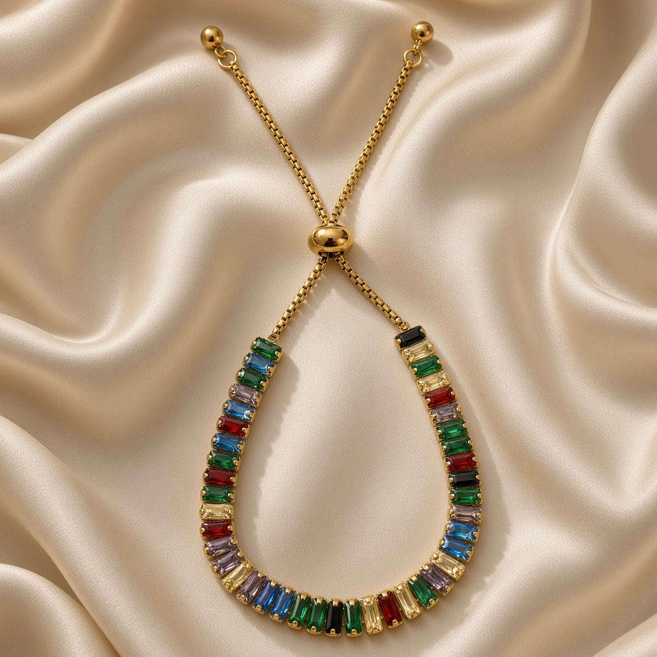 Colourful rectangular stone adjustable bracelet displayed on satin