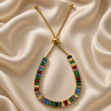 Colourful rectangular stone adjustable bracelet displayed on satin